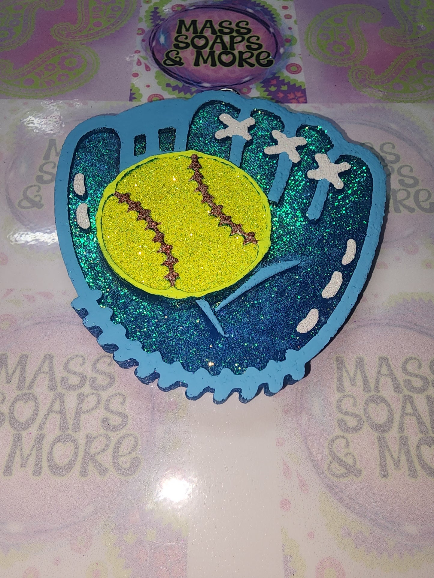 Glove with softball freshie